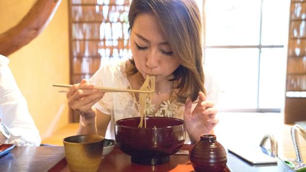 It is a tradition in Japan to noisily slurp down noodles to show appreciation for the food. But foreign visitors are often bothered by the noise.(AFP)