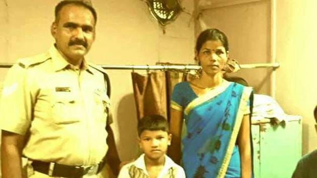 Om Shirsad Sathe with his mother and RPF constable DN Sawji, who rescued him. Om Shirsad Sathe with his mother and RPF constable DN Sawji, who rescued him.