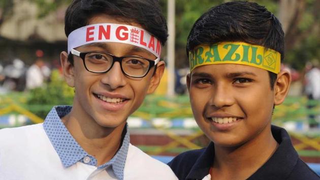 England and Brazil fans pose ahead of the semifinal encounter. (SAMIR JANA/HT PHOTO) England and Brazil fans pose ahead of the semifinal encounter. (SAMIR JANA/HT PHOTO)