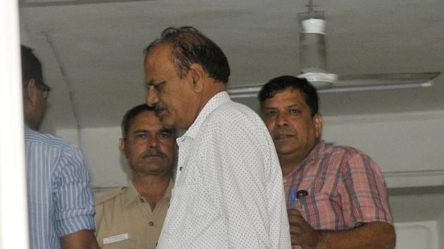 Mohan Singh (in white shirt) arrested by the CBI at the Sector-31 police station on Tuesday. (Karun Sharma/HT) Mohan Singh (in white shirt) arrested by the CBI at the Sector-31 police station on Tuesday. (Karun Sharma/HT)