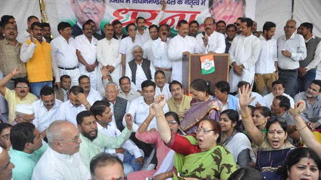 Congress workers and MLAs protest against the BJP government at Gandhi Park in the state capital on Wednesday. (Vinay S Kumar/HT) Congress workers and MLAs protest against the BJP government at Gandhi Park in the state capital on Wednesday. (Vinay S Kumar/HT)