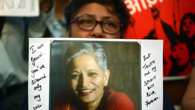 A protester holds a placard in a rally condemning the killing of journalist Gauri Lankesh in Mumbai on September 6, 2017. (AFP Photo) A protester holds a placard in a rally condemning the killing of journalist Gauri Lankesh in Mumbai on September 6, 2017. (AFP Photo)