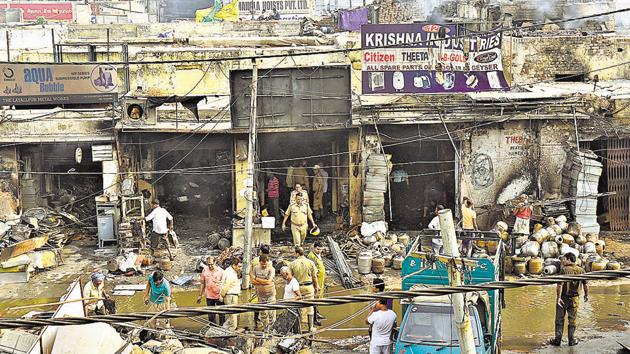 By the time fire tenders doused the flames, property worth several crores of rupees had been reduced into ashes and rubble. Shopkeepers at the market have estimated the damage at over R5 crore. (Arvind Yadav/HT PHOTO) By the time fire tenders doused the flames, property worth several crores of rupees had been reduced into ashes and rubble. Shopkeepers at the market have estimated the damage at over R5 crore. (Arvind Yadav/HT PHOTO)
