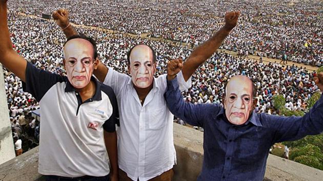 Patidars or members of Patel community wear masks of Sardar Vallabhbhai Patel as they participate in a rally in Ahmedabad.(AP File Photo) Patidars or members of Patel community wear masks of Sardar Vallabhbhai Patel as they participate in a rally in Ahmedabad.(AP File Photo)