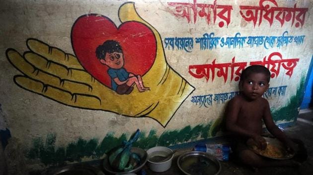 A Rohingya refugee boy, who crossed the border from Myanmar this week, eats while taking shelter at Seagull Primary School, in the Kutupalong refugee camp, near Cox's Bazar on October 23, 2017. (Hannah McKay / REUTERS)
