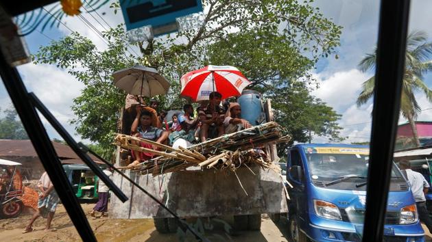 Rohingya refugees travel on a truck, as they shift to another camp, outside the Palong Khali refugee camp near Cox's Bazar on October 23, 2017. (Adnan Abidi / REUTERS)