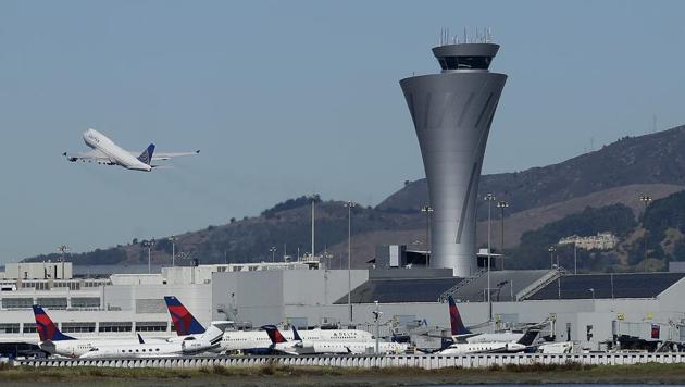 The air traffic control tower is in sight as a plane takes off from San Francisco International Airport, Tuesday, Oct. 24, 2017, in San Francisco. (AP) The air traffic control tower is in sight as a plane takes off from San Francisco International Airport, Tuesday, Oct. 24, 2017, in San Francisco. (AP)