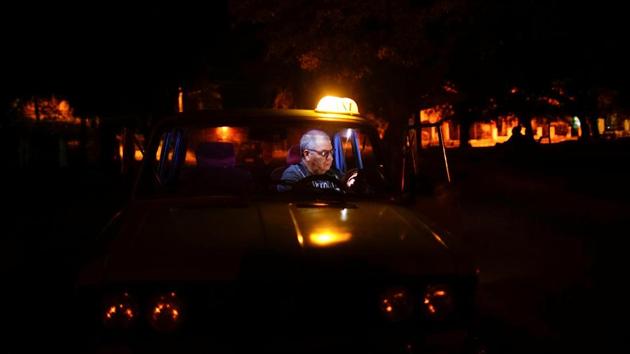 A few meters further on, Rene Almeida, 62, sat in his taxi checking email. He said he felt lucky that his two children had moved to the US where communications are better than ever. It was only in 2008 that the government first allowed Cubans to own cell phones. He too complained of the lack of privacy and the expense. ‘It’s better than nothing,’ he said. ‘But it should improve. It will.’ (Alexandre Meneghini / REUTERS)