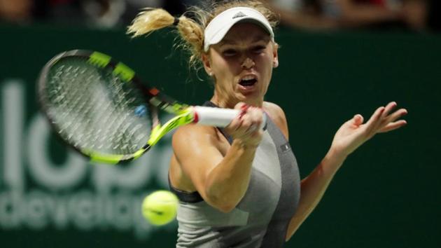 Caroline Wozniacki in action during her group stage match with Simona Halep at the WTA Finals. (REUTERS) Caroline Wozniacki in action during her group stage match with Simona Halep at the WTA Finals. (REUTERS)