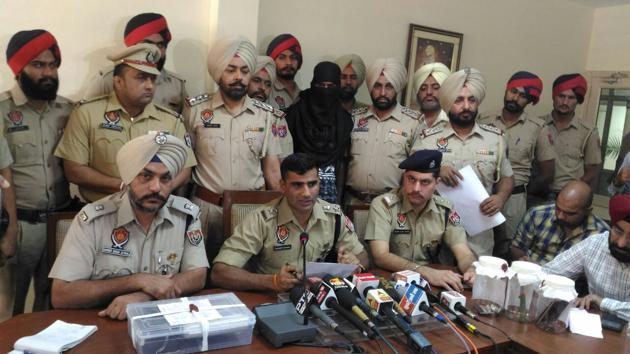 SSP Mohali Kuldeep Chahal (centre) addressing a press conference at the SSP office in Mohali on October 26. The accused from UP was intercepted in the car after a chase on Sohana road on Wednesday night. Police sources said he confessed to being involved in the murder. (Anil Dayal/ht)
