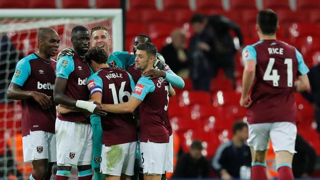 West Ham United players celebrate their win over Tottenham Hotspur in the League Cup on Wednesday. (REUTERS) West Ham United players celebrate their win over Tottenham Hotspur in the League Cup on Wednesday. (REUTERS)