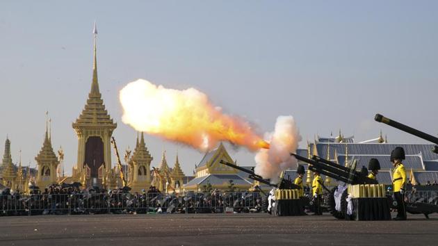 An artillery gun is fired at the funeral procession and royal cremation ceremony of late Thai King Bhumibol Adulyadej, in Bangkok, on October 26, 2017. A budget of 3 billion baht ($90 million) has been set aside for the funeral, which will be attended by dozens of heads of state, including King Jigme Khesar Namgyel Wangchuck of Bhutan and Japan’s Prince Akishino and Princess Kiko. (Wason Wanichakorn / AP)