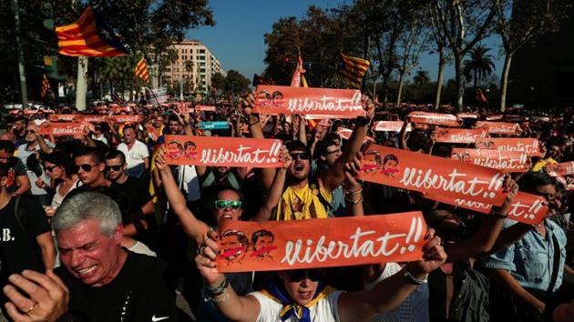 Demonstrators hold up banners reading ‘Freedom’ in reference to the jailed leaders of Catalan pro-independence movements ANC (Catalan National Assembly) and Omnium Cutural, Jordi Sanchez and Jordi Cuixart, near the Catalan regional parliament in Barcelona, Spain. (REUTERS)