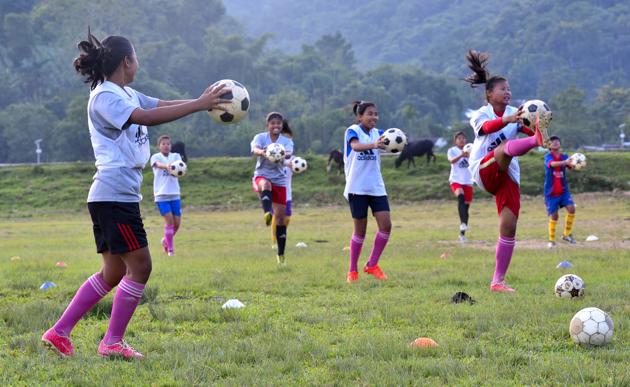 A practice session underway at the club maidan. AMMA was set up in 1982, as a self-help group meant to promote animal husbandry, weaving and crafts among women. In the ’90s, the club began encouraging young girls to play football in the adjacent ground. It has since produced national- and international-level players like Rina Salam, who currently plays for the Indian women’s team.(Anshuman Poyrekar / HT Photo)