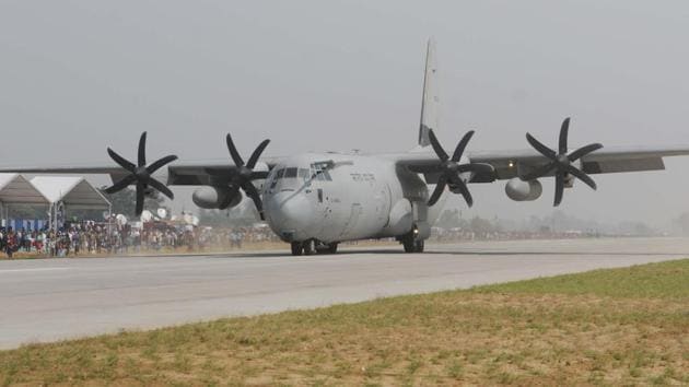 An Indian Air Force C-130 Hercules transport aircraft lands on the Lucknow-Agra Expressway during the IAF drill in Bangarmau, Unnao district. The aircraft was trailed by Garud commandos and their vehicles who disembarked from it, taking position on either side of the ‘air strip’ to cordon it off for fighter operations. (Subhankar Chakraborty / HT Photo )