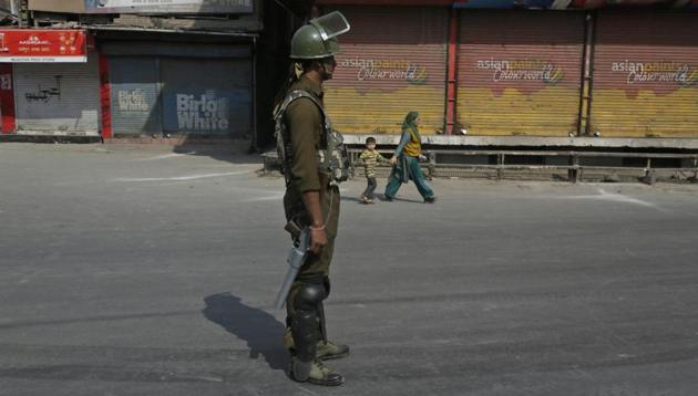 Paramilitary soldier stands guard during a strike called by separatists in Srinagar on October 21, 2017. (AP File Photo) Paramilitary soldier stands guard during a strike called by separatists in Srinagar on October 21, 2017. (AP File Photo)