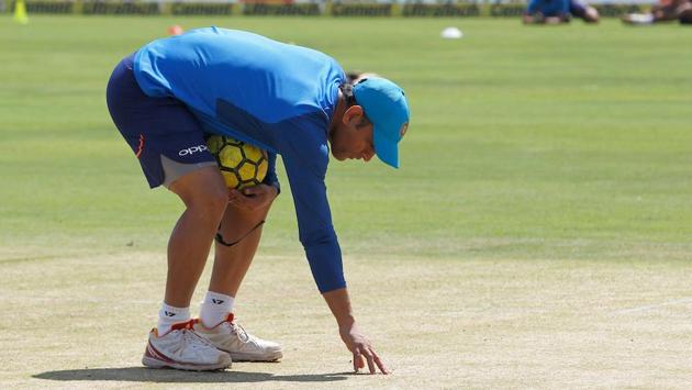 MS Dhoni inspects the pitch ahead of the 2nd ODI between India and New Zealand in Pune on Wednesday.(BCCI)