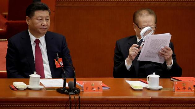 Chinese President Xi Jinping (L) and former Chinese President Jiang Zemin are seen during the closing session of the 19th National Congress of the Communist Party of China a in Beijing, China on October 24, 2017. (Jason Lee / REUTERS)