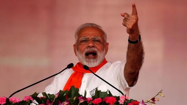 Prime Minister Narendra Modi addresses his supporters during a public rally at Bhaat village on the outskirts of Ahmedabad, October 16, 2017.