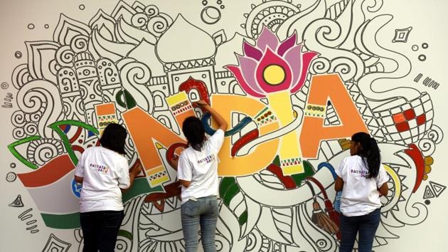 A group of girls painting a wall during the ‘Paryatan Parv - Grand Finale’ organized by Ministry of Tourism at Rajpath Lawns in New Delhi. This 21-day festival was celebrated across the country in collaboration with other central ministries and state governments. (Sonu Mehta / HT Photo)