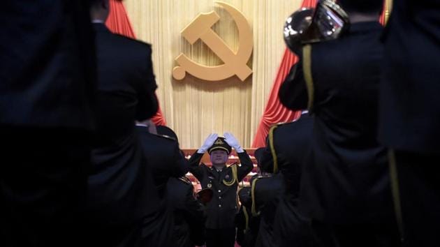 A Chinese People's Liberation Army (PLA) officer practices conducting a military band before the opening session of the Chinese Communist Party's five-yearly Congress at the Great Hall of the People in Beijing on October 18, 2017. (AFP Photo) A Chinese People's Liberation Army (PLA) officer practices conducting a military band before the opening session of the Chinese Communist Party's five-yearly Congress at the Great Hall of the People in Beijing on October 18, 2017. (AFP Photo)