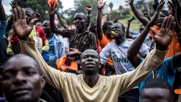 Supporters of National Super Alliance (NASA) presidential candidate Raila Odinga pray during a protest prior to a political rally in Kenya's capital Nairobi on October 25, 2017. (Luis Tato / AFP)