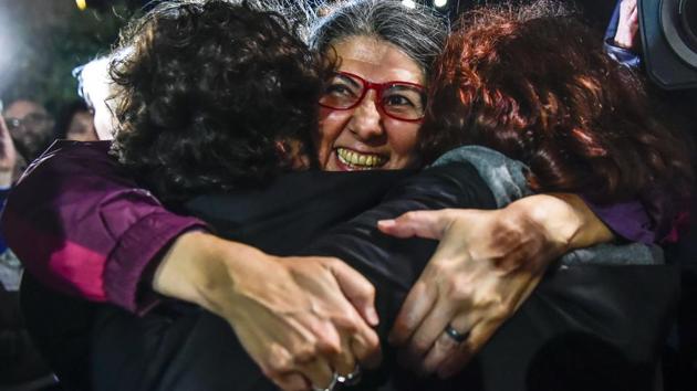 Ozlem Dalkiran(C), member of Citizens' Assembly is seen after her release from Silivri prison in Istanbul on October 26, 2017. (Yasin Akgul / AFP)