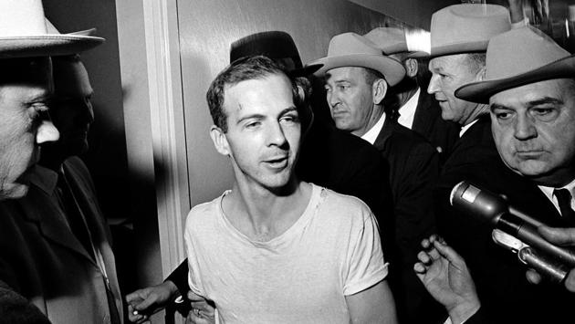 In this Nov. 23, 1963, file photo, surrounded by detectives, Lee Harvey Oswald talks to the media at the Dallas police station for another round of questioning for the assassination of U.S. President John F. Kennedy. Oswald’s death was perhaps one of the reasons for people to believe Kennedy’s assassination was a larger conspiracy. (AP) In this Nov. 23, 1963, file photo, surrounded by detectives, Lee Harvey Oswald talks to the media at the Dallas police station for another round of questioning for the assassination of U.S. President John F. Kennedy. Oswald’s death was perhaps one of the reasons for people to believe Kennedy’s assassination was a larger conspiracy. (AP)