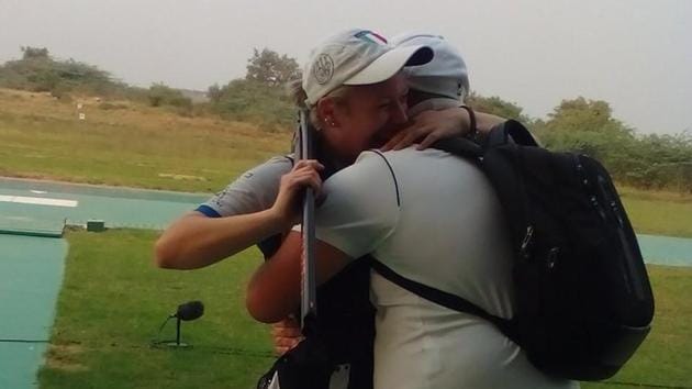 Alessia Iezzi (L) celebrates with a team official after winning the gold medal in trap at the ISSF World Cup Final in New Delhi on(Navneet Singh/Twitter)