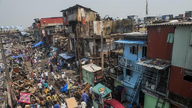 Residents of Garib Nagar slum at Bandra collect their belongings on Friday. (Satish Bate/HT) Residents of Garib Nagar slum at Bandra collect their belongings on Friday. (Satish Bate/HT)