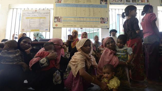 In this photograph taken on October 24, 2017, Rohingya Muslim refugees wait inside a government-run family planning centre in the Bangladeshi town of Palongkhali. (AFP) In this photograph taken on October 24, 2017, Rohingya Muslim refugees wait inside a government-run family planning centre in the Bangladeshi town of Palongkhali. (AFP)