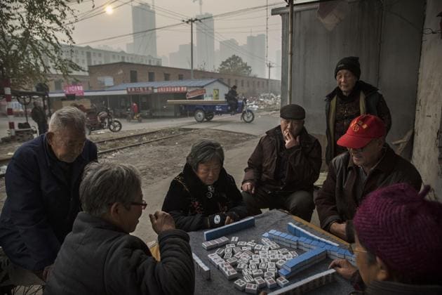 File photo of elderly people playing a game next to the railway tracks in Hebei, just outside Beijing. (Getty Images) File photo of elderly people playing a game next to the railway tracks in Hebei, just outside Beijing. (Getty Images)