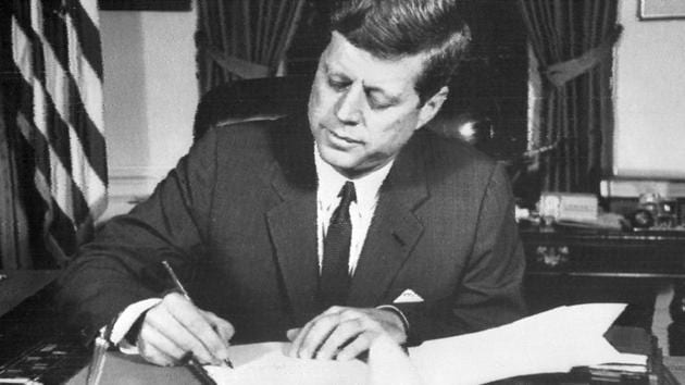This file photo taken on October 24, 1962 shows US President John Fitzgerald Kennedy signing the order of naval blockade of Cuba at the White House in Washington, DC, during the Cuban missiles crisis.(AFP File Photo)