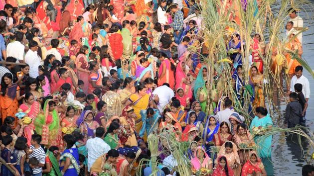 The Chhat Puja, dedicated to the Sun God and his wife Usha to thank them for bestowing the bounties of life on earth, being performed at Chinchwad ghat in Pune on Thursday. (HT PHOTO)