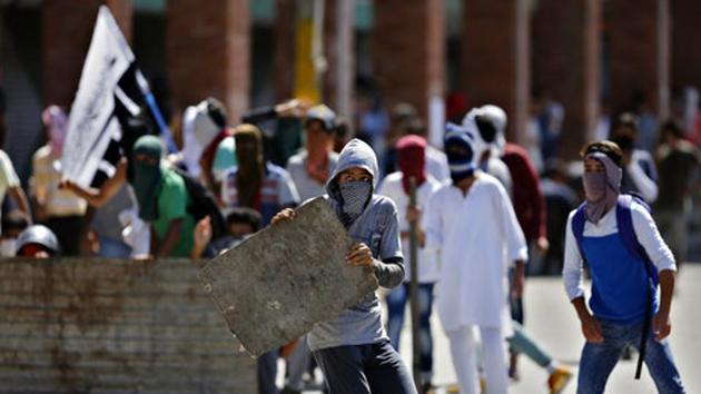 Masked Kashmiris participate in a protest in Srinagar. (AP File Photo) Masked Kashmiris participate in a protest in Srinagar. (AP File Photo)