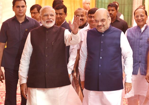 PM Narendra Modi and BJP President Amit Shah at the party headquarters in New Delhi on Saturday. (Raj K Raj/HT Photo) PM Narendra Modi and BJP President Amit Shah at the party headquarters in New Delhi on Saturday. (Raj K Raj/HT Photo)