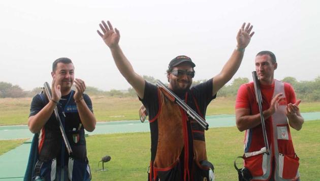 Spain’s Alberto Fernandez (C) celebrates after winning gold in the men’s trap event on the concluding day of the ISSF World Cup Final.(ISSF)