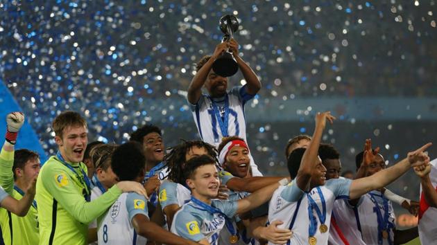 England footballers celebrate with the trophy after winning the FIFA U-17 World Cup title. (REUTERS) England footballers celebrate with the trophy after winning the FIFA U-17 World Cup title. (REUTERS)