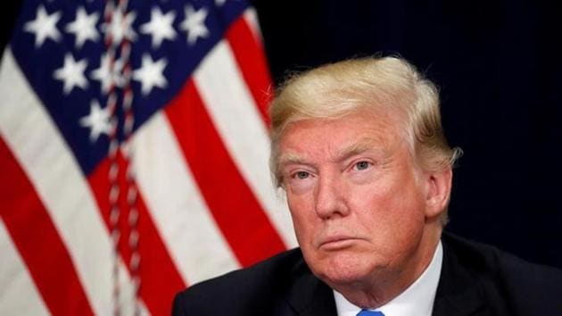 US President Donald Trump listens during a briefing on hurricane Harvey recovery efforts in Dallas, Texas on October 25, 2017. (Reuters)