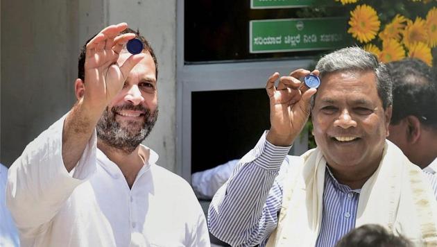 Congress vice-president Rahul Gandhi and Karnataka CM Siddaramaiah show a token during the inauguration of ‘Indira Canteen’ in Bengaluru. (PTI FILE) Congress vice-president Rahul Gandhi and Karnataka CM Siddaramaiah show a token during the inauguration of ‘Indira Canteen’ in Bengaluru. (PTI FILE)