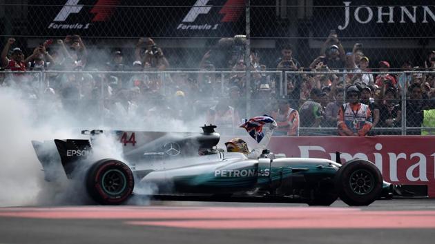 However, the day belonged to Lewis Hamilton as he secured his fourth world title in dramatic circumstances. (AFP)