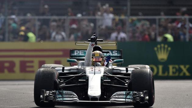 Hamilton, who was starting from third, collided with Sebastian Vettel and he was pushed back to last position. (AFP)