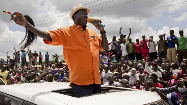 Opposition leader Raila Odinga greets supporters in the slum of Kawangware in Nairobi on October 29, 2017. Warning that Kenya is in ‘grave danger’, Odinga said in an interview with The Associated Press on Sunday that the country’s repeat presidential election was a sham and that a second re-vote should be held within 90 days. Countering IEBC claims, Odinga said only 3.5 million had cast ballots. (PTI / AP) 
