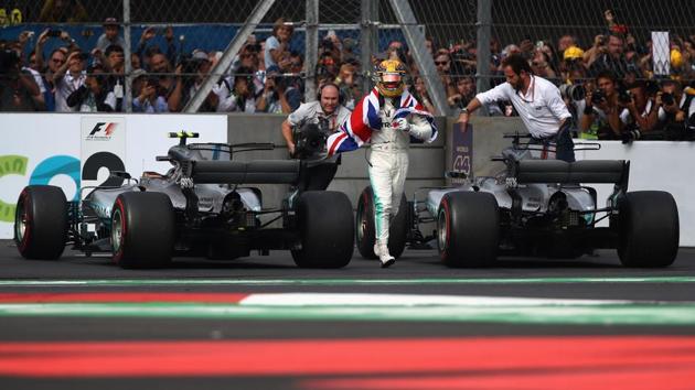 With Vettel finishing only in fourth position, the eighth place finish was enough for Hamilton to secure his fourth world title. (AFP)