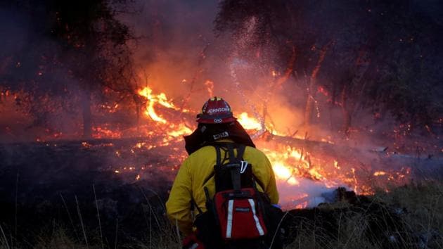 Firefighters battle a wildfire near Santa Rosa, California, U.S., October 14, 2017.(REUTERS File Photo)