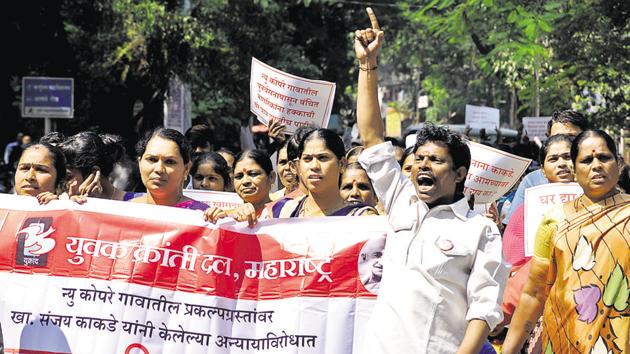 Residents of New Kopre village and Yukrand activists protest against MP Sanjay Kakade for not rehabilitating 15 families after acquiring their land for various government projects including Khadakwasla dam and the National Defence Academy (NDA) in the 1960s. (HT PHOTO) Residents of New Kopre village and Yukrand activists protest against MP Sanjay Kakade for not rehabilitating 15 families after acquiring their land for various government projects including Khadakwasla dam and the National Defence Academy (NDA) in the 1960s. (HT PHOTO)