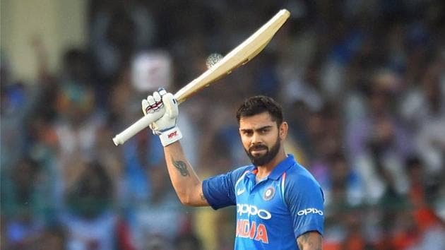 Virat Kohli celebrates his century during 3rd ODI cricket match against New Zealand at Green Park Stadium in Kanpur on Sunday. Virat Kohli today returned to the top of the ICC ODI rankings for batsmen after logging career-high rating points.(PTI)