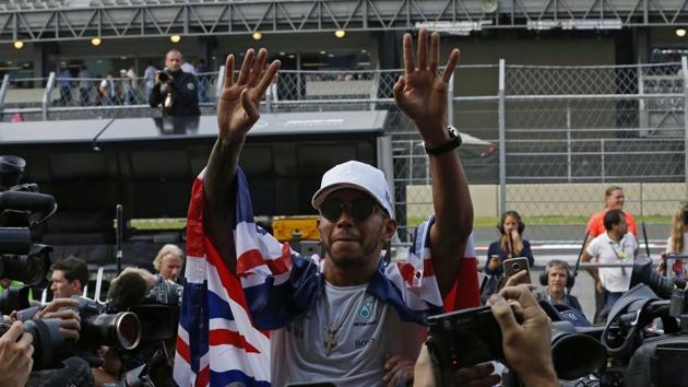 Lewis Hamilton secured his fourth world championship in dramatic style as he battled back from last to finish eighth in the Mexico Grand Prix. Max Verstappen won the race. (AP)