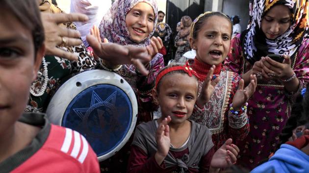 The ISIS group had banned music and dance, imposed strict dress codes, prevented women from wearing make-up and forcefully prohibited the mixing of men and women. But in Jazra on Friday, music mingled with the sound of generators providing the only electricity in the ravaged district, which like much of the city was heavily damaged during more than four months of fighting. (Delil souleiman / AFP) 