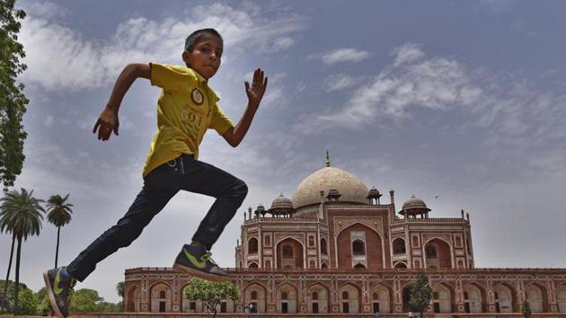 A boy enjoying pleasant weather near Humayun Tomb in New Delhi. (HT File Photo) A boy enjoying pleasant weather near Humayun Tomb in New Delhi. (HT File Photo)